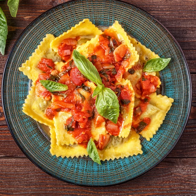 A bowl of Rana Ricotta & Spinach Ravioli with Carbonara-Inspired Sauce