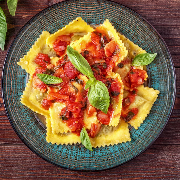 A bowl of Rana Ricotta & Spinach Ravioli with Carbonara-Inspired Sauce