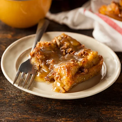 A slice of Walnut Bread Pudding with Vanilla Caramel Sauce