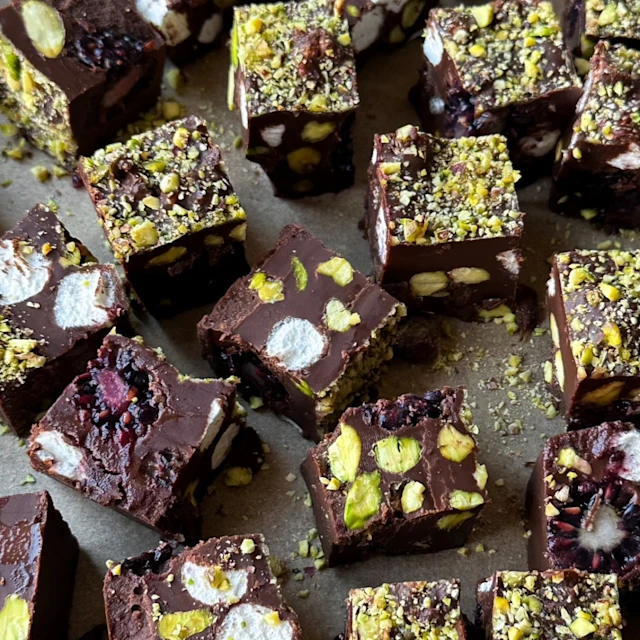 Small squares of blackberry pistachio fudge