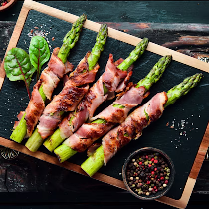 A plate of Grilled Bacon-Wrapped Asparagus
