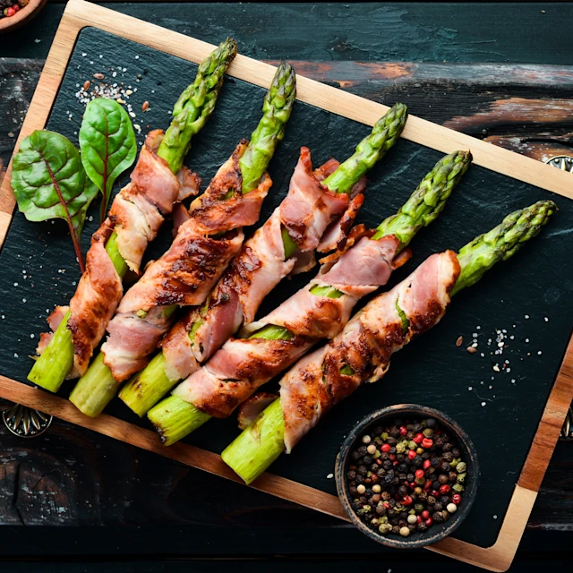 A plate of Grilled Bacon-Wrapped Asparagus