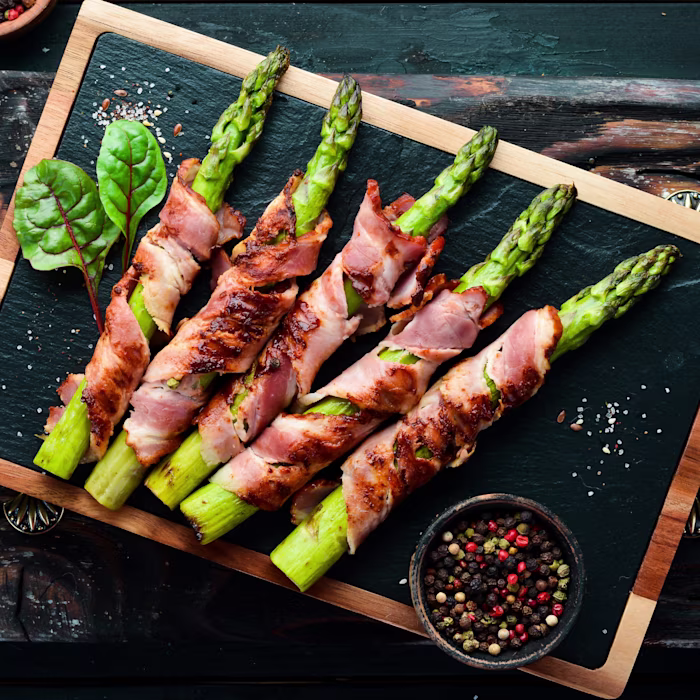 A plate of Grilled Bacon-Wrapped Asparagus