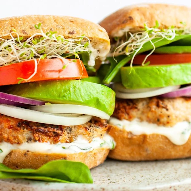Two grilled turkey burgers side by side