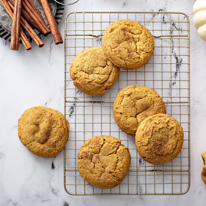 Freshly baked Soft Pumpkin Spice Oatmeal Cookies on a cooling rack