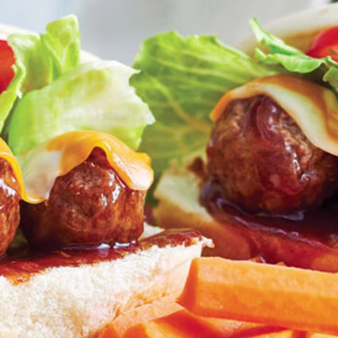 Meatball sliders served with carrot sticks