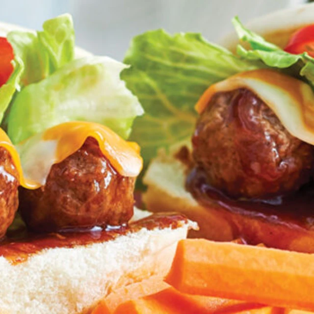 Meatball sliders served with carrot sticks