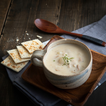 Serving of clam chowder with crackers