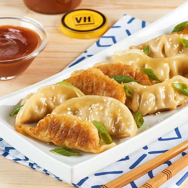 Image of sesame dumplings with Plum Sauce