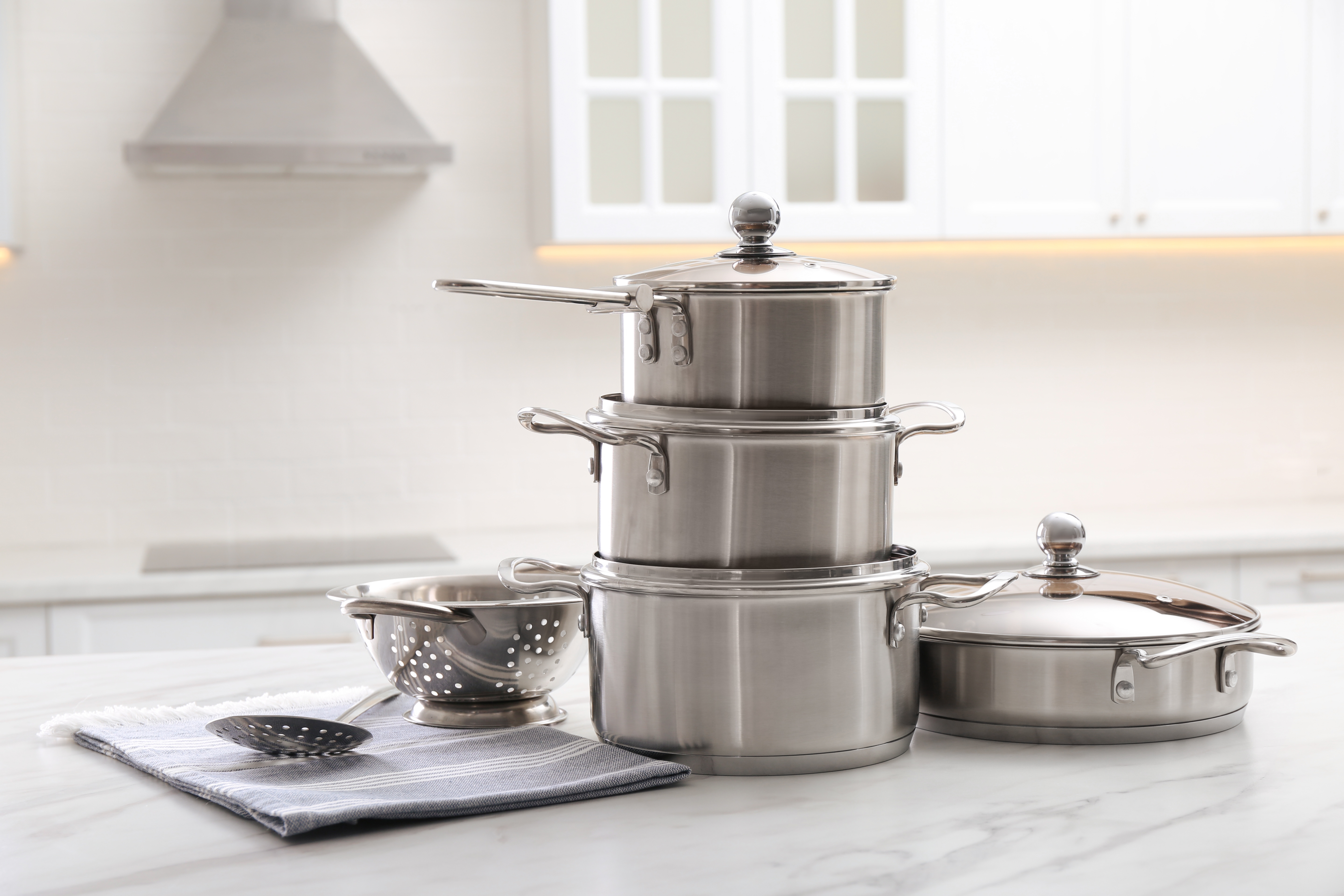 Pots and pans stacked together on a counter