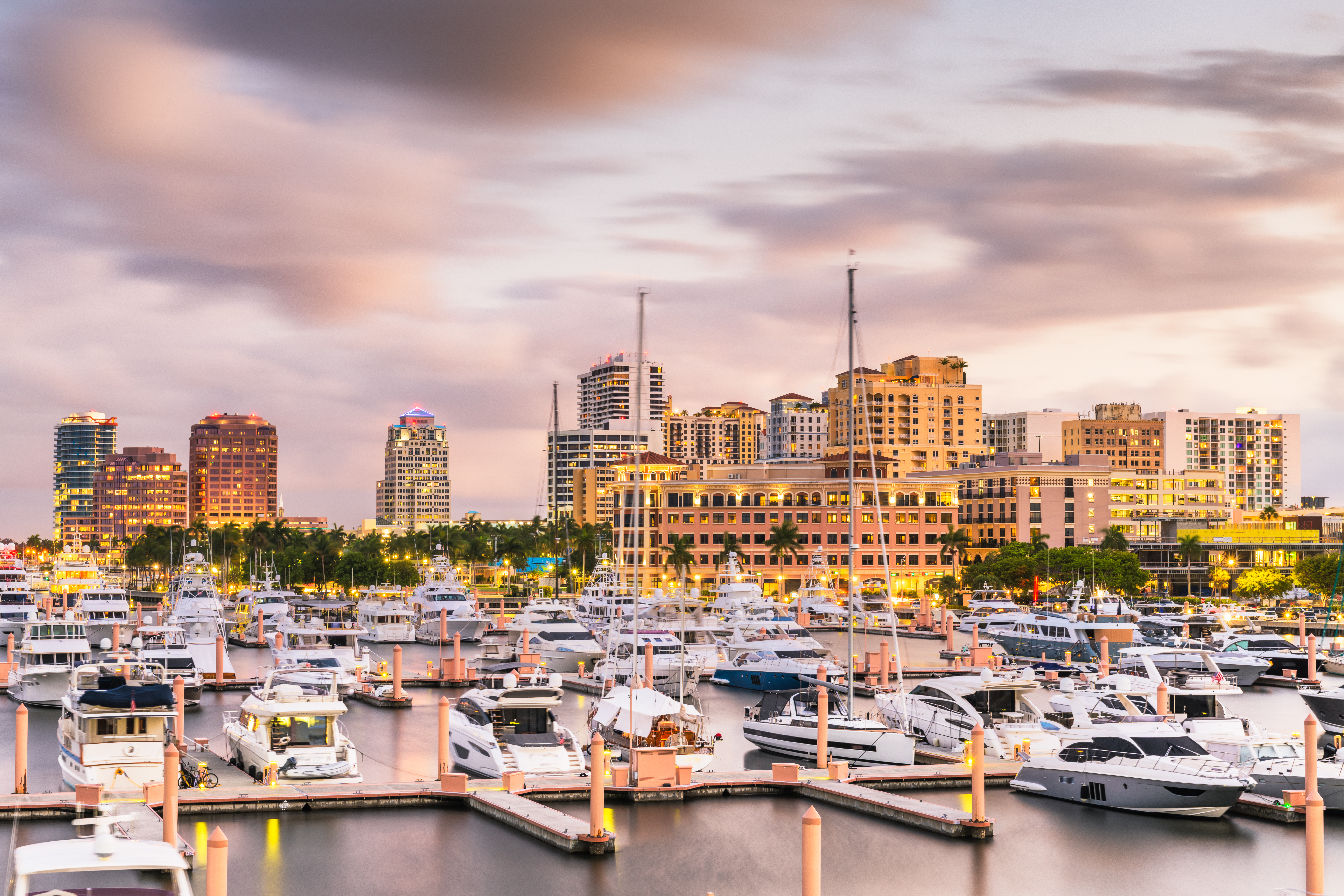 Skyline view of St. Port Lucie with the harbor and boats in the foreground.