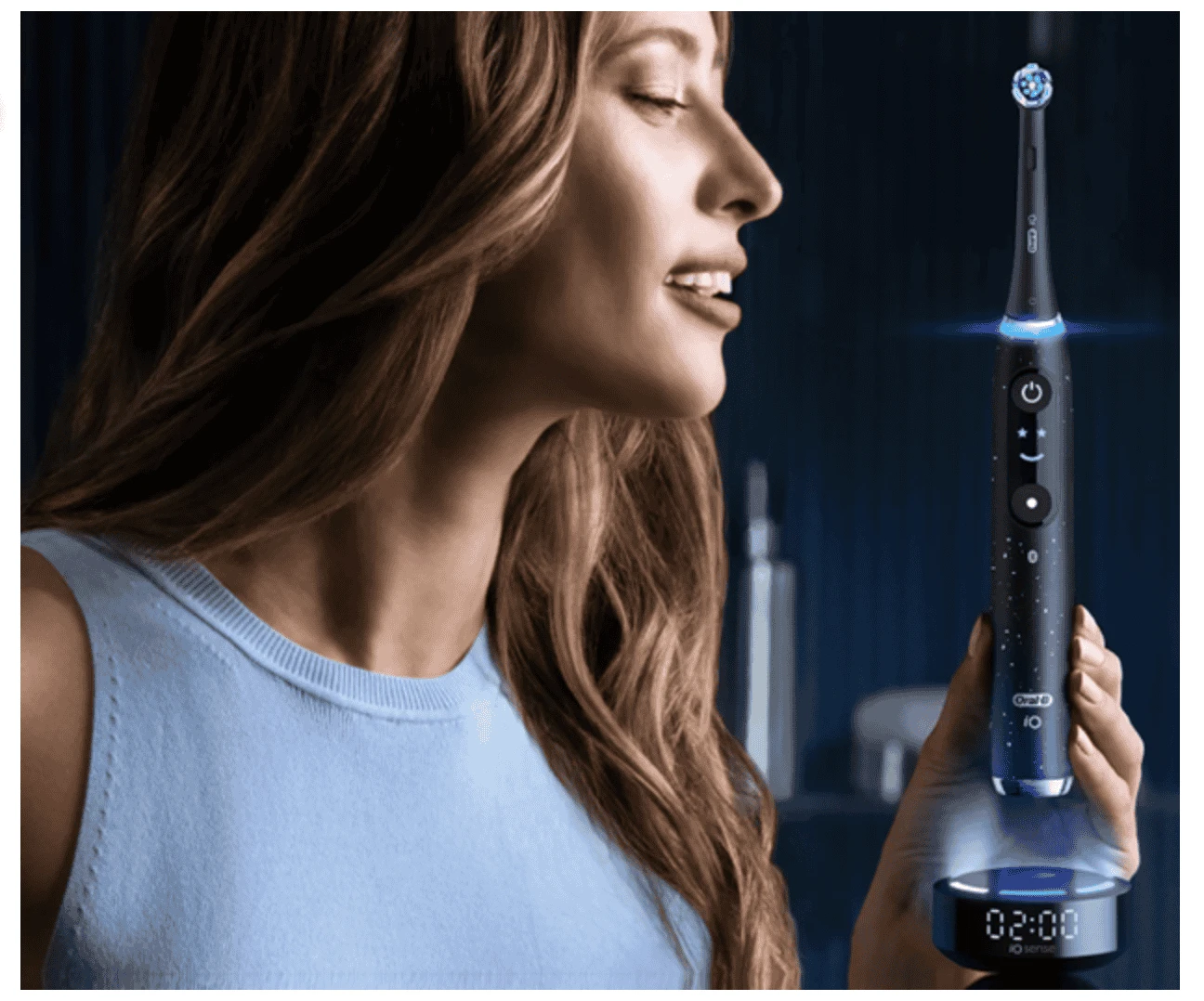 Woman holding an Oral-B toothbrush