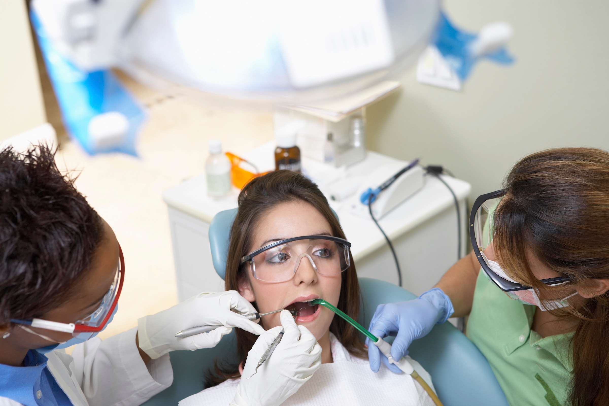 Dentist and patient in a dental exam | Crest