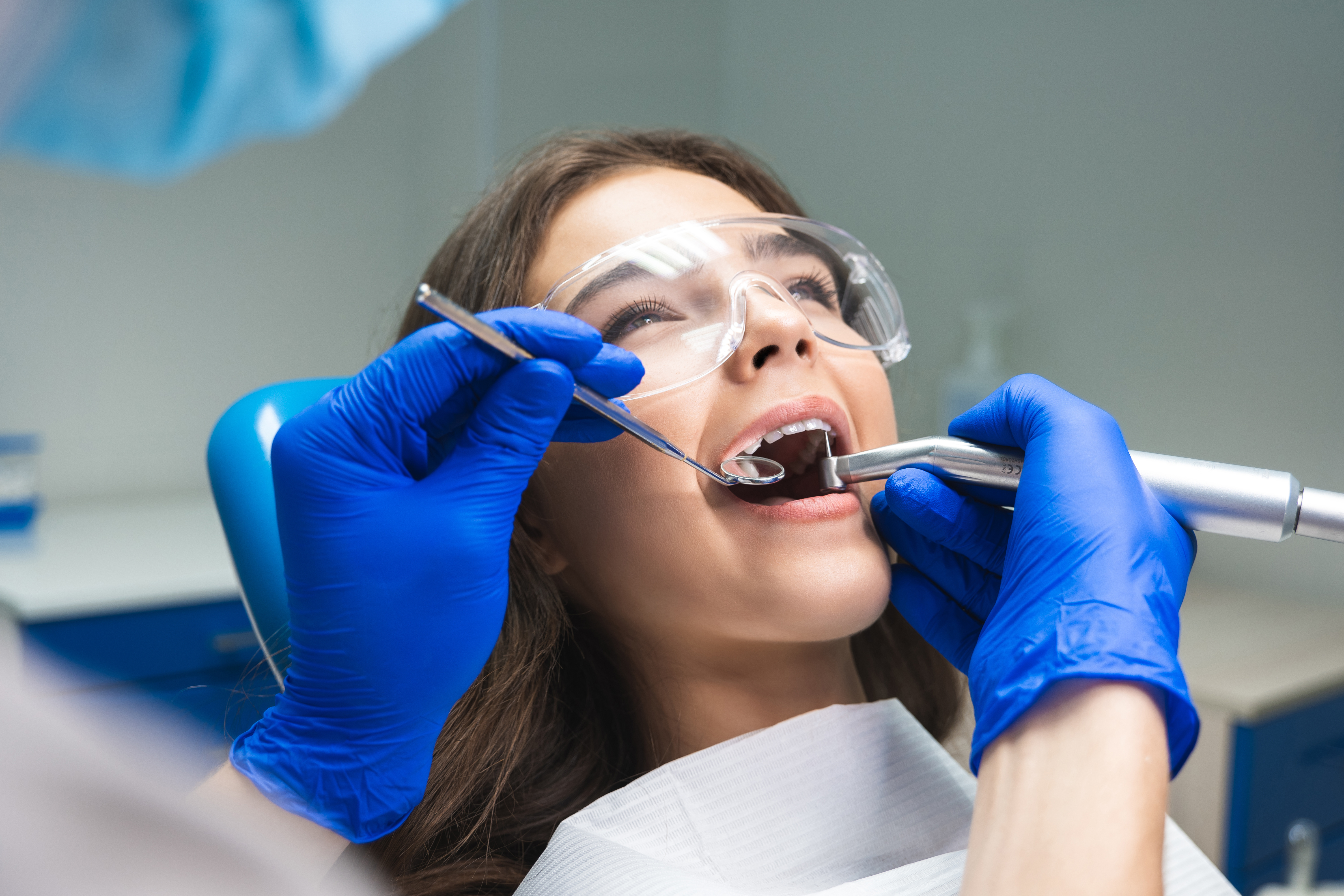 Female patient being examined at dental clinic