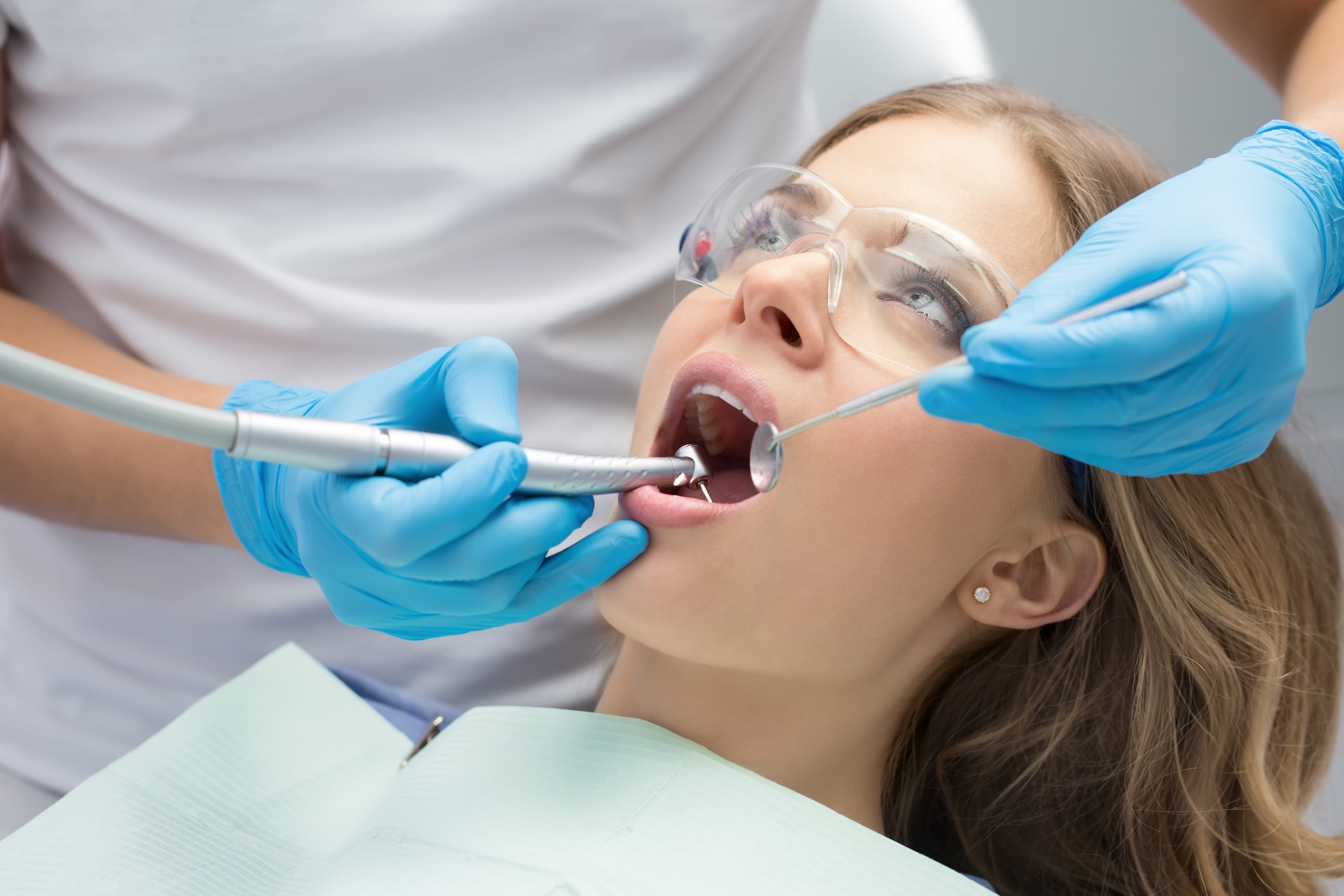 A person being examined by a dentist | Crest