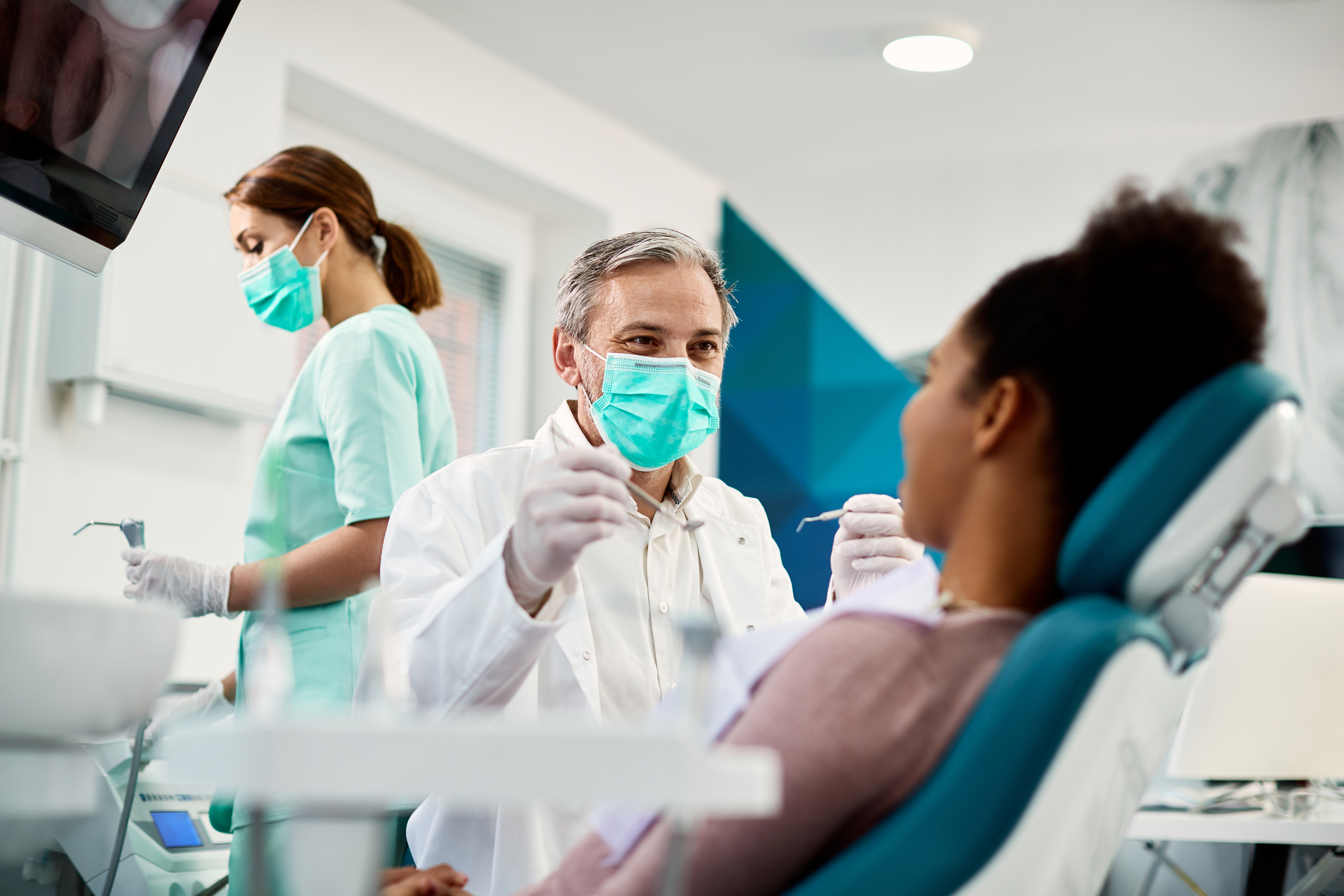  A person at the dentist for a semi-annual checkup and cleaning | Crest