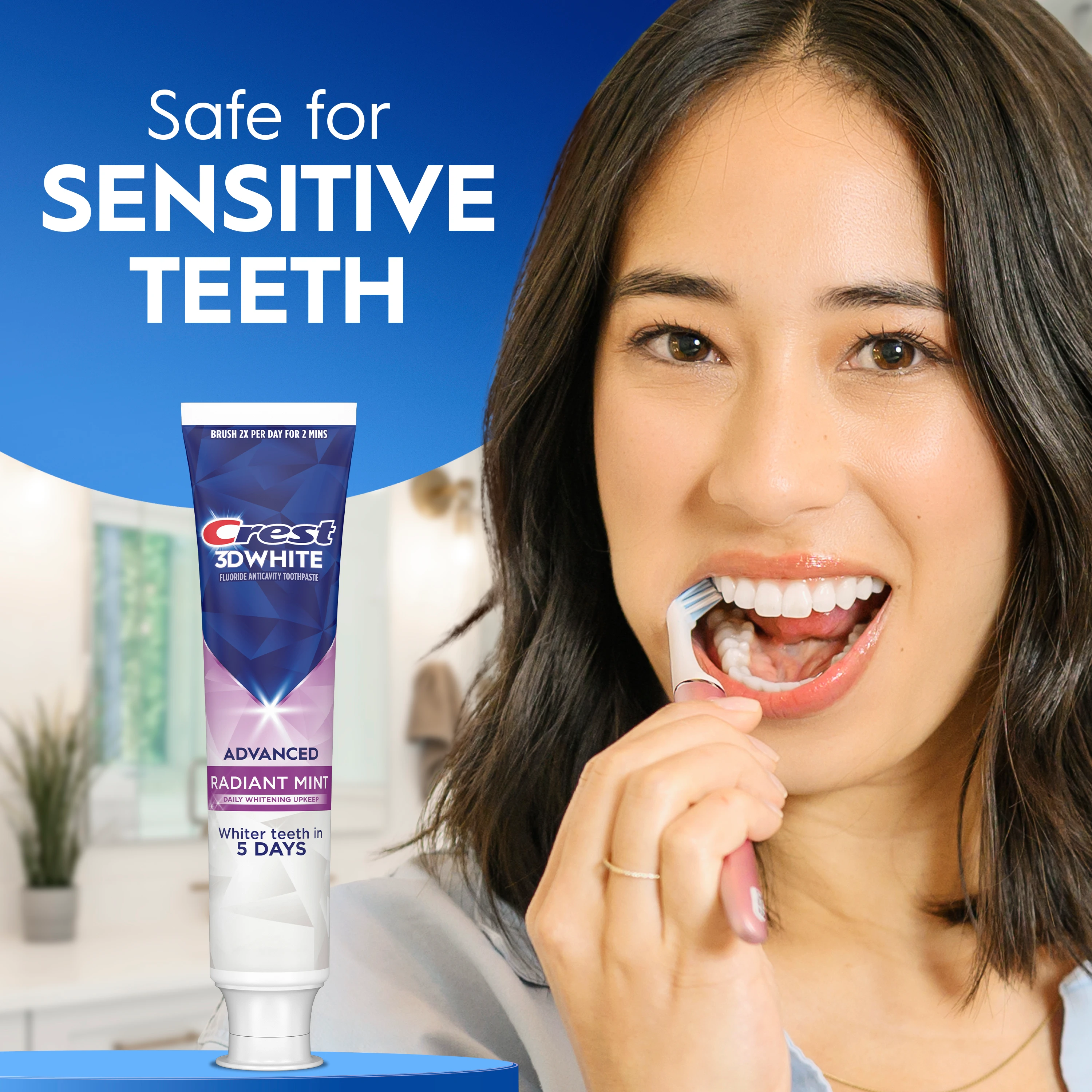 Woman brushing her teeth with the Crest 3DWhite Whitening Toothpaste, Advanced Radiant Mint. Safe for Sensitive Teeth.