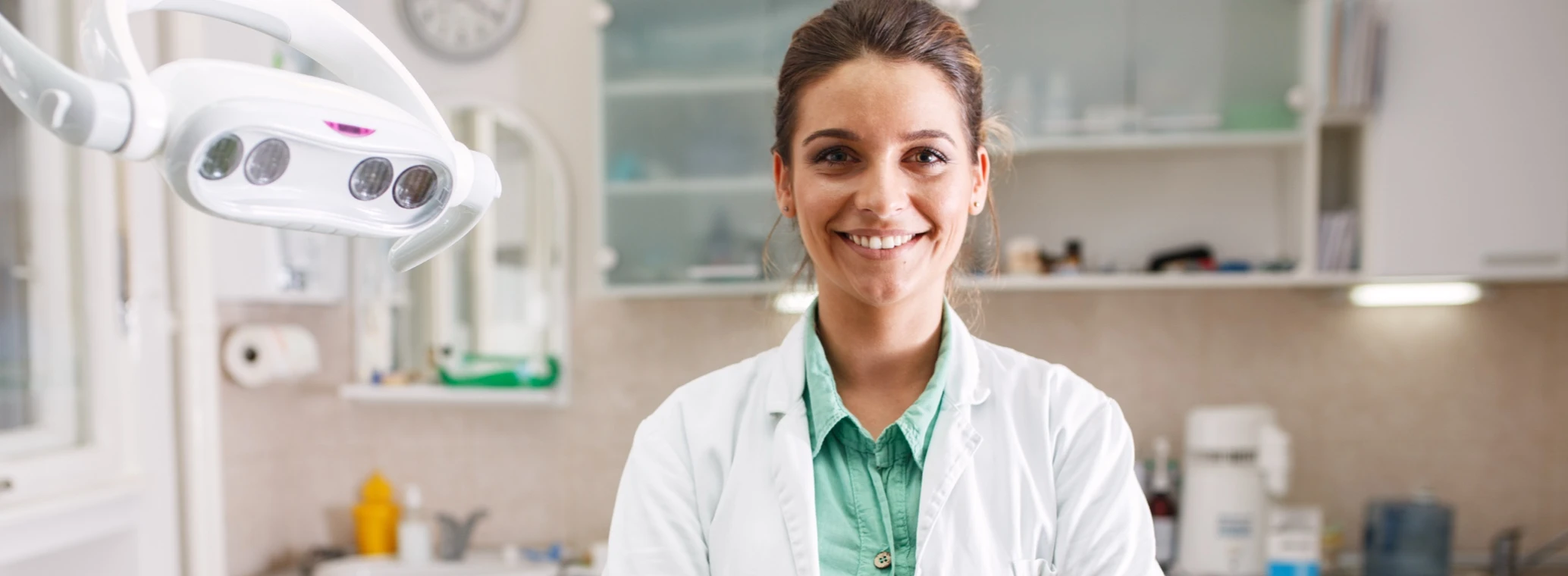 Dentist professional standing with their arms folded