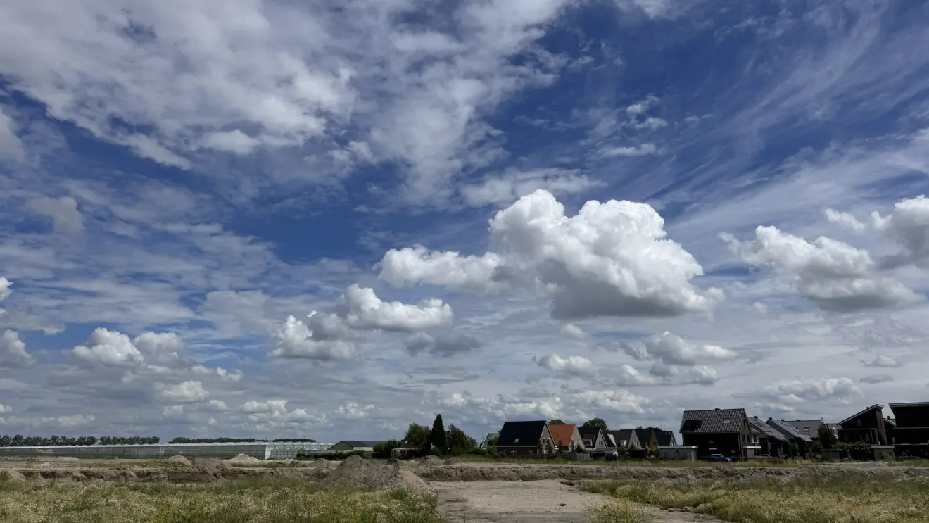 Zon en stapelwolken - Jolanda Bakker