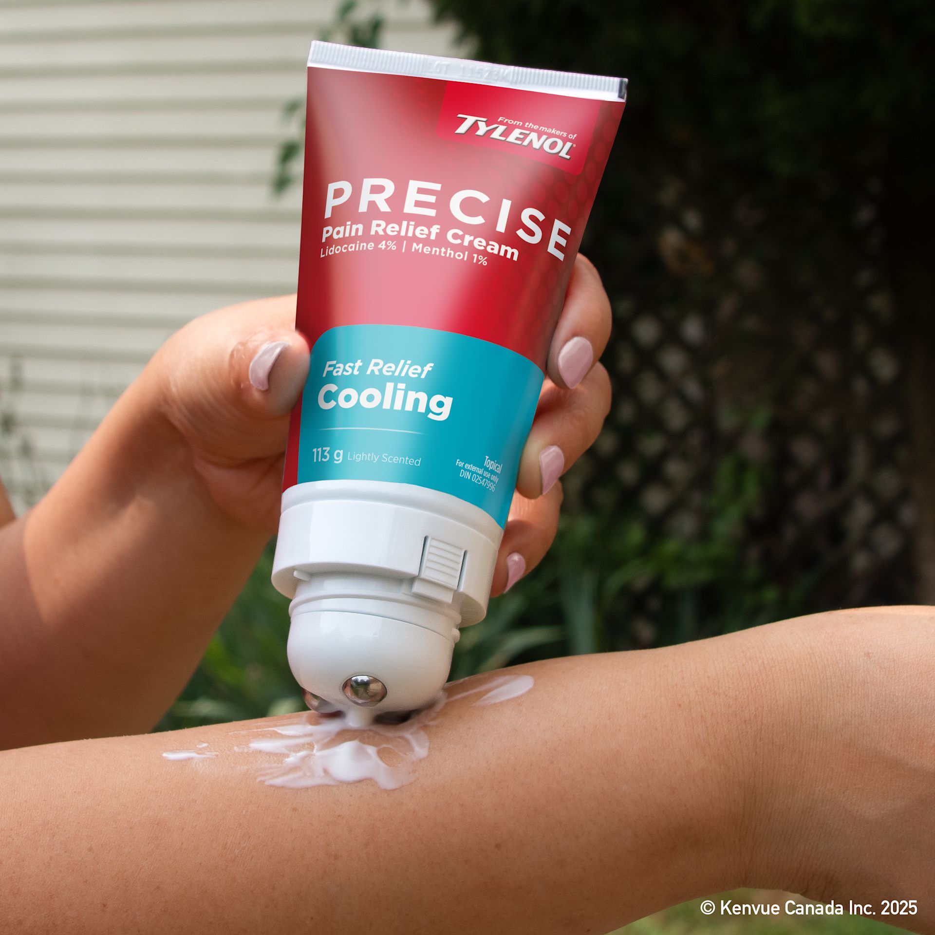 Person applying Precise Cooling Pain Relief Cream from the makers of TYLENOL to their arm for pain relief