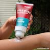 Person applying Precise Cooling Pain Relief Cream from the makers of TYLENOL to their arm for pain relief