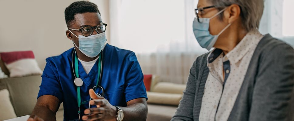 Doctor speaking with his patient