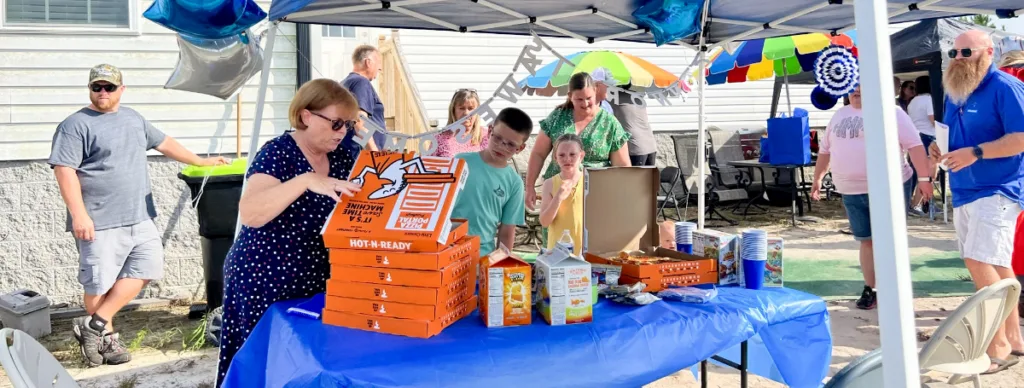 Team members & customers build pool for wish kid image
