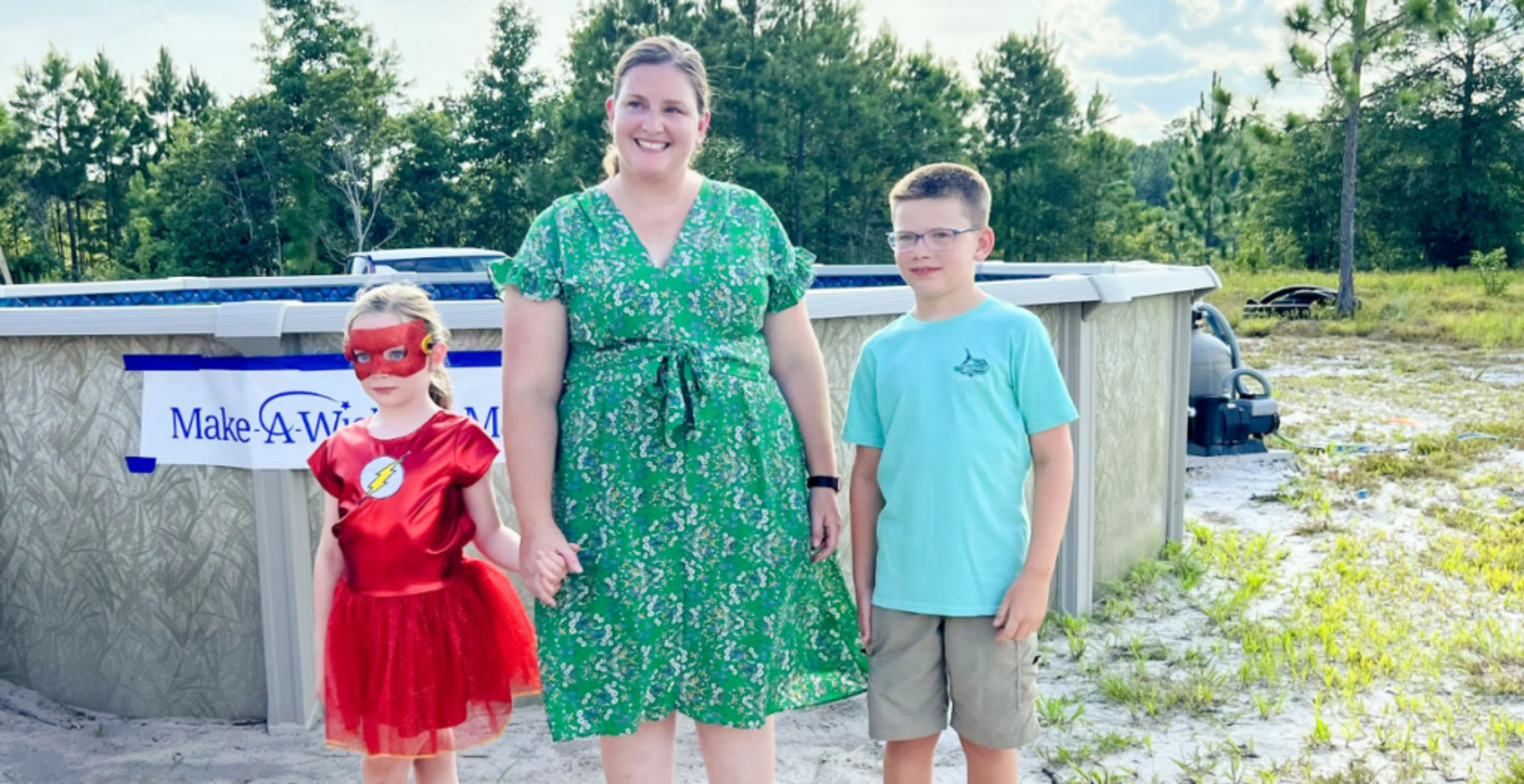 Team members & customers build pool for wish kid image
