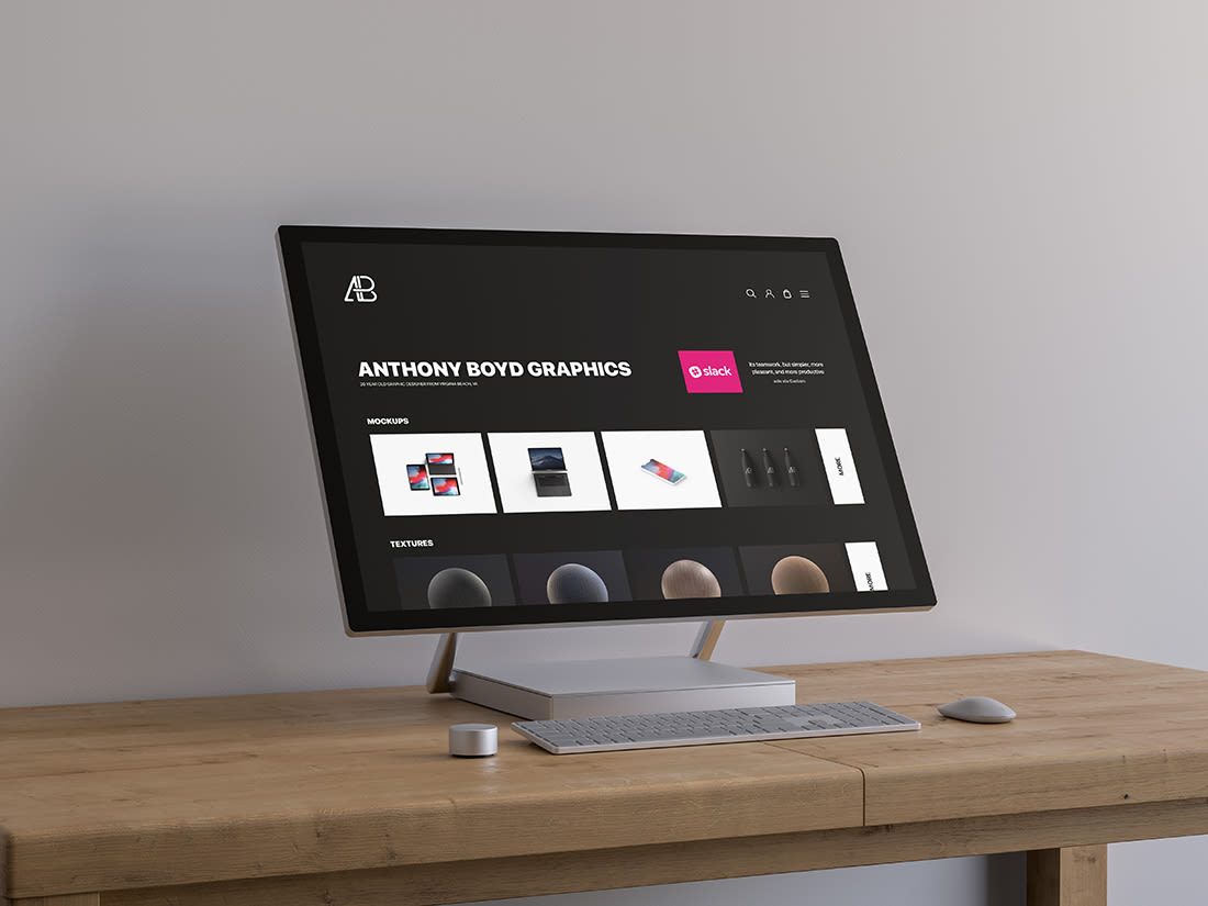 Surface Studio On Table Mockup by Anthony Boyd Graphics