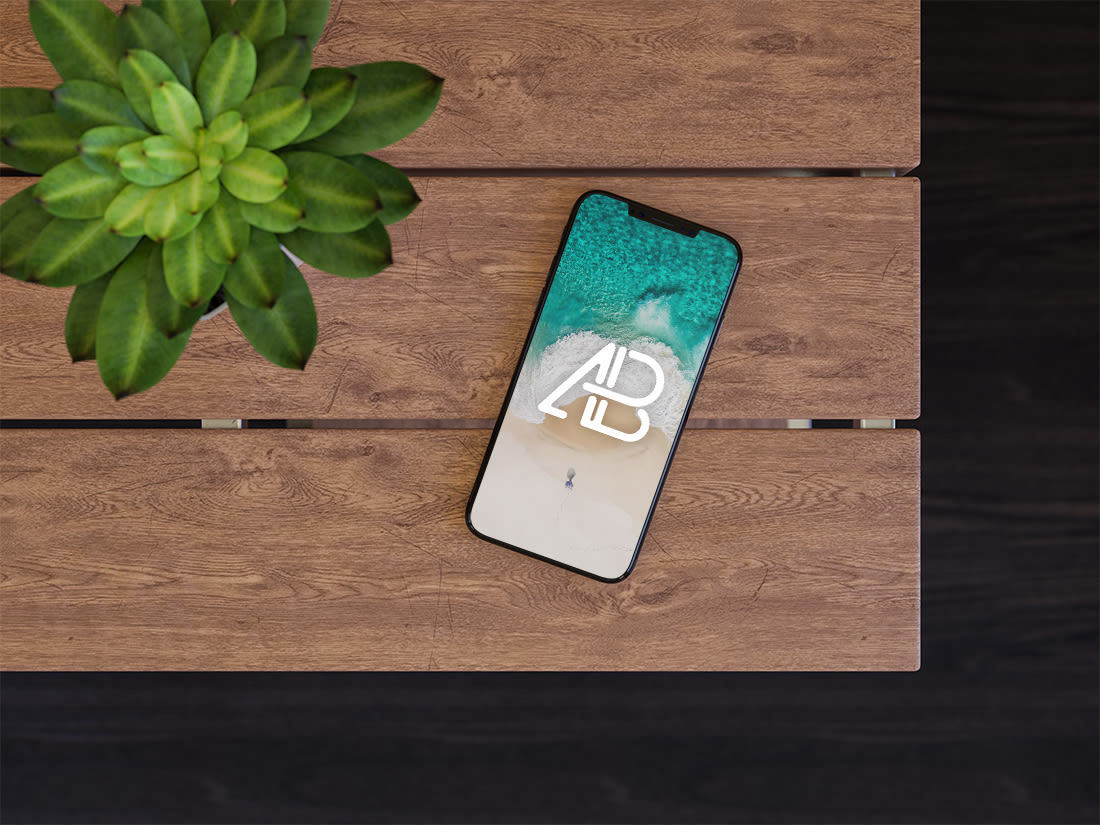 iPhone X On Table Mockup by Anthony Boyd Graphics