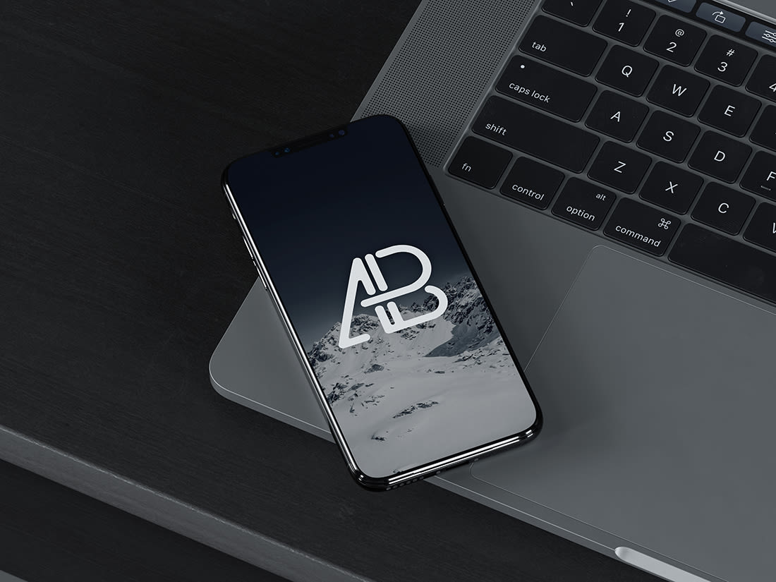 iPhone X On MacBook Pro Mockup by Anthony Boyd Graphics