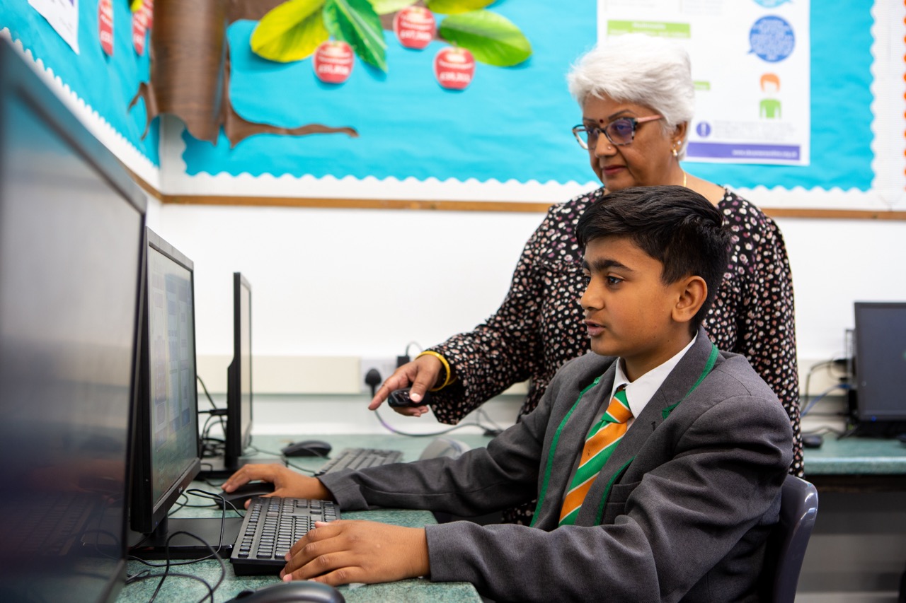 Teacher and Student at a computer