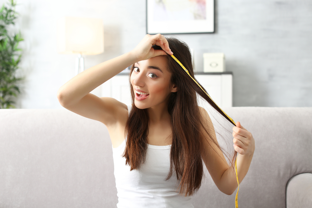 Woman measuring hair