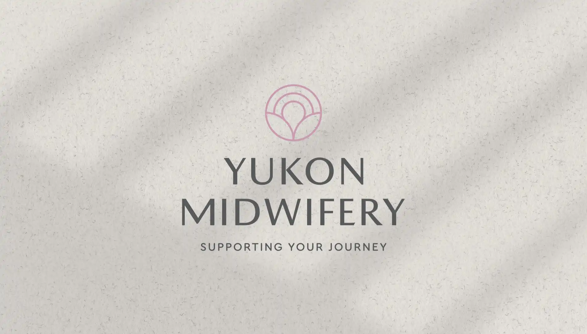 Yukon Midwifery logo designed by MBDC, featuring stylized text and gentle, supportive imagery.