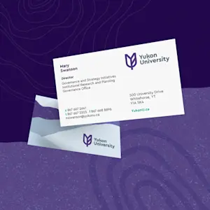 Yukon University collateral design with modern branding elements on a teal and white background