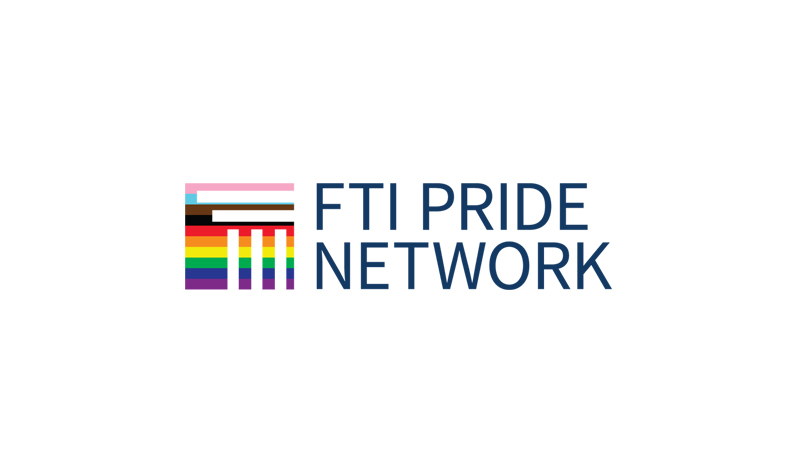 Logo of FTI Pride Network with a stylized design featuring LGBTQ+ rainbow and transgender flag colors beside the text on a white background.