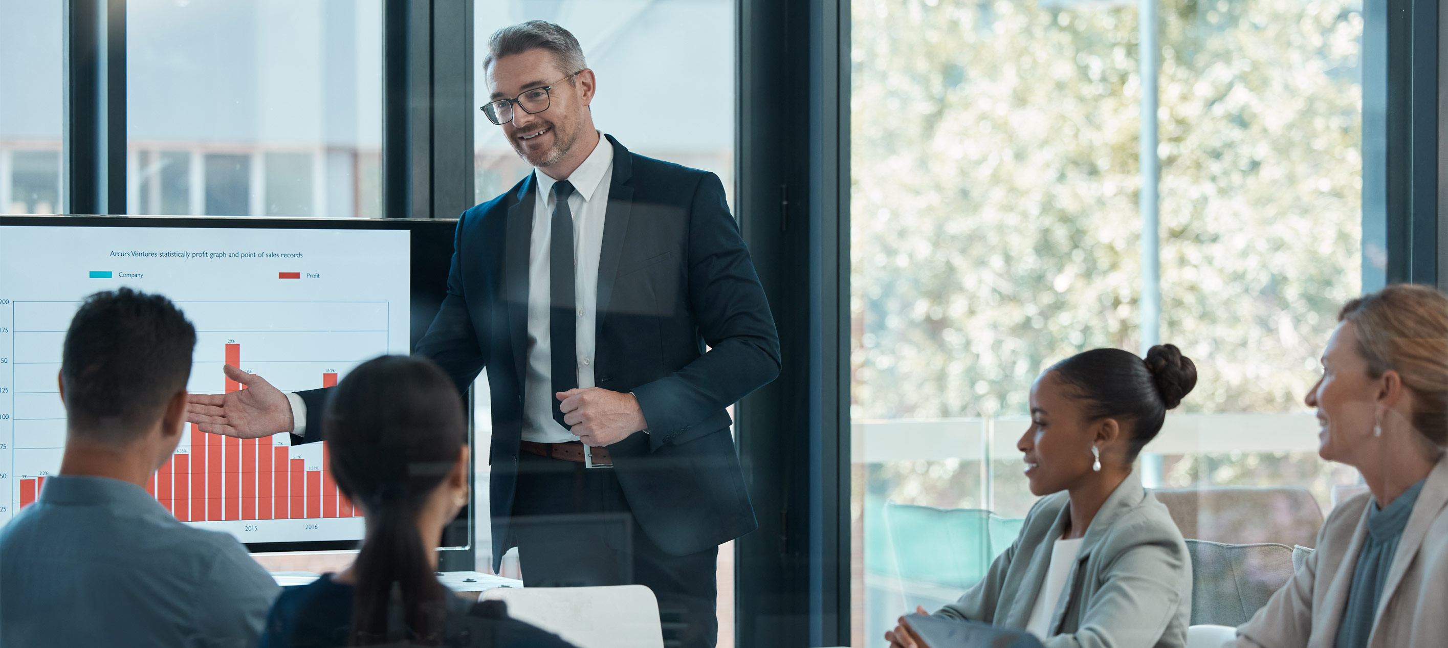 Executive presents sales data to leadership team