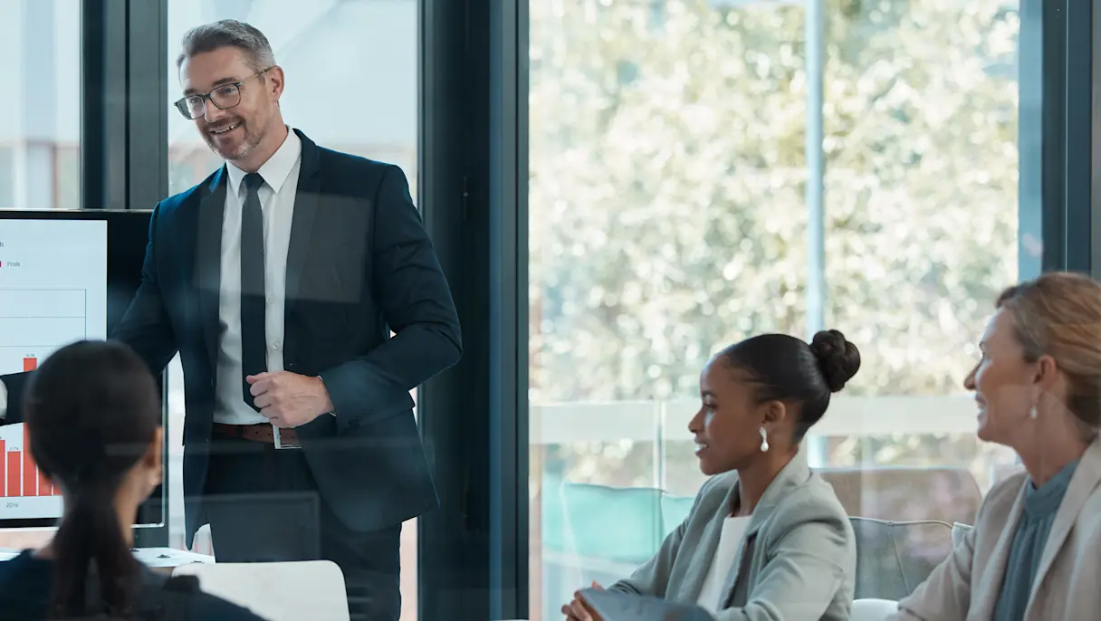 Executive presents sales data to leadership team