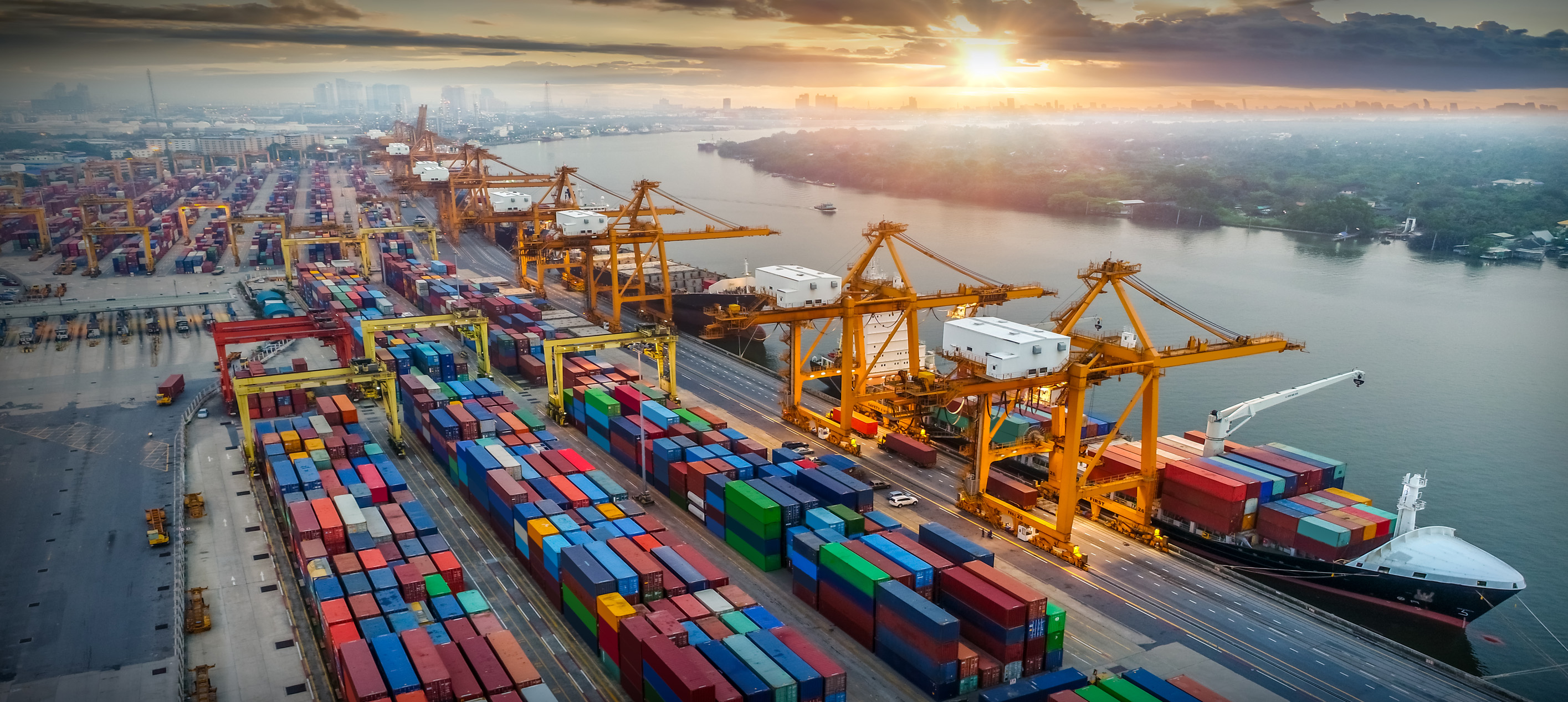 Container port with cargo ships at sunrise view