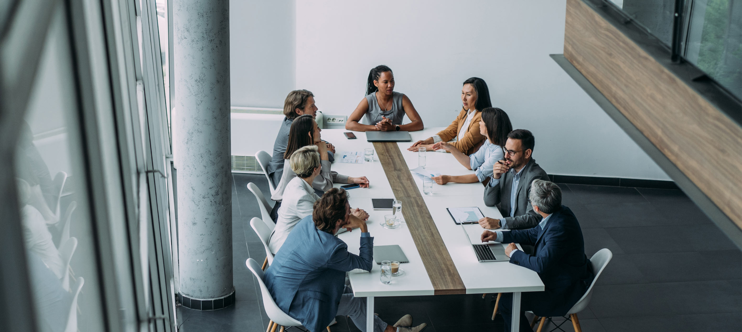 A group of professionals meeting at a conference table