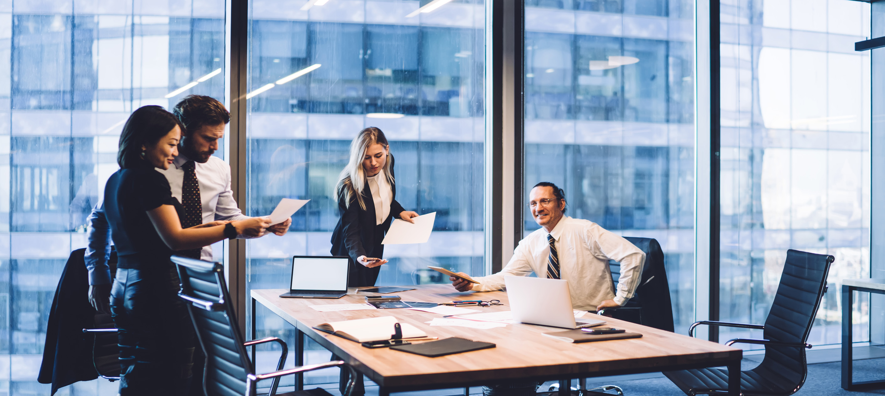Business team reviewing documents in meeting room