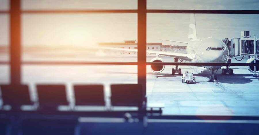 An airplane view from the window of an airport terminal