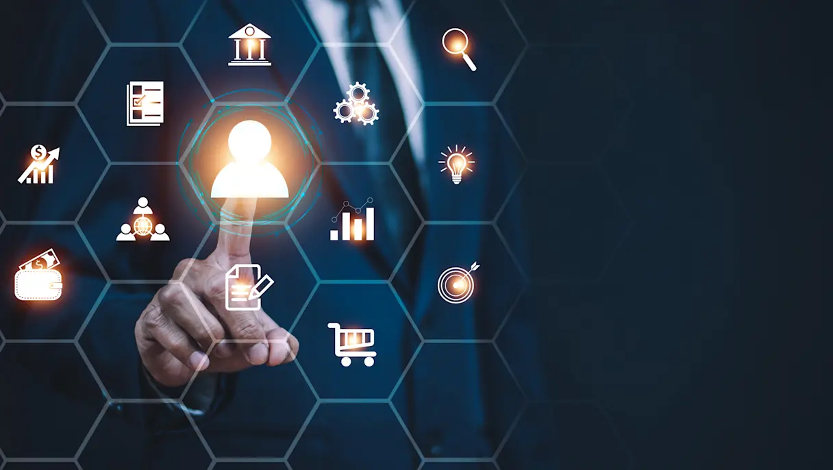 Hand selecting user icon on digital business interface.