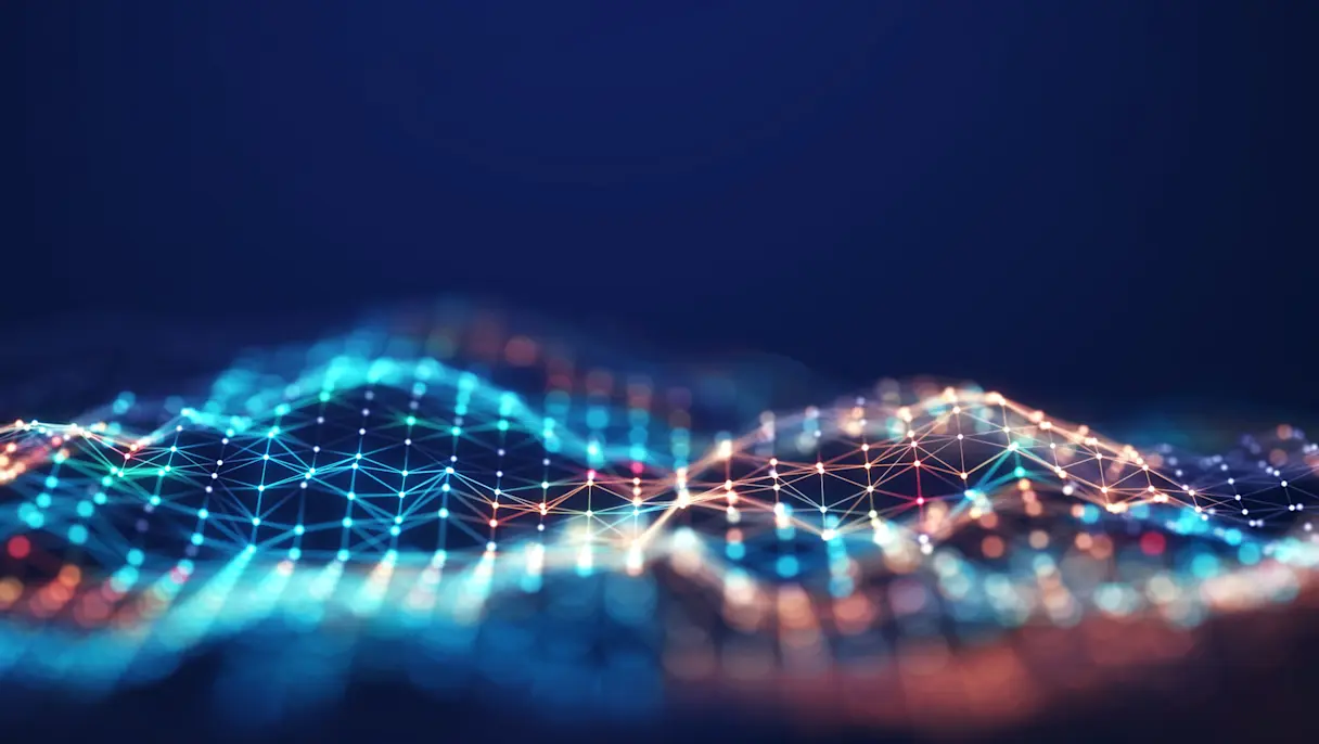 Abstract digital landscape of glowing blue and orange interconnected nodes forming wave-like patterns against a dark blue background.