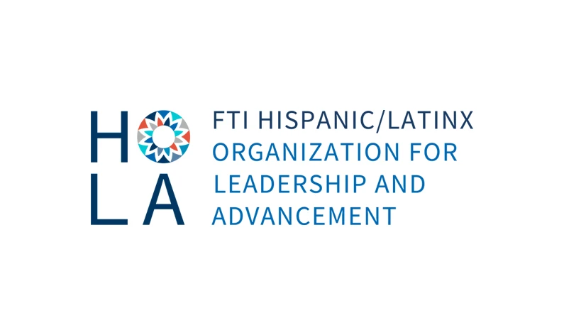 Logo of FTI Hispanic/Latinx Organization for Leadership and Advancement featuring the acronym HOLA with a colorful circular pattern inside the letter O.
