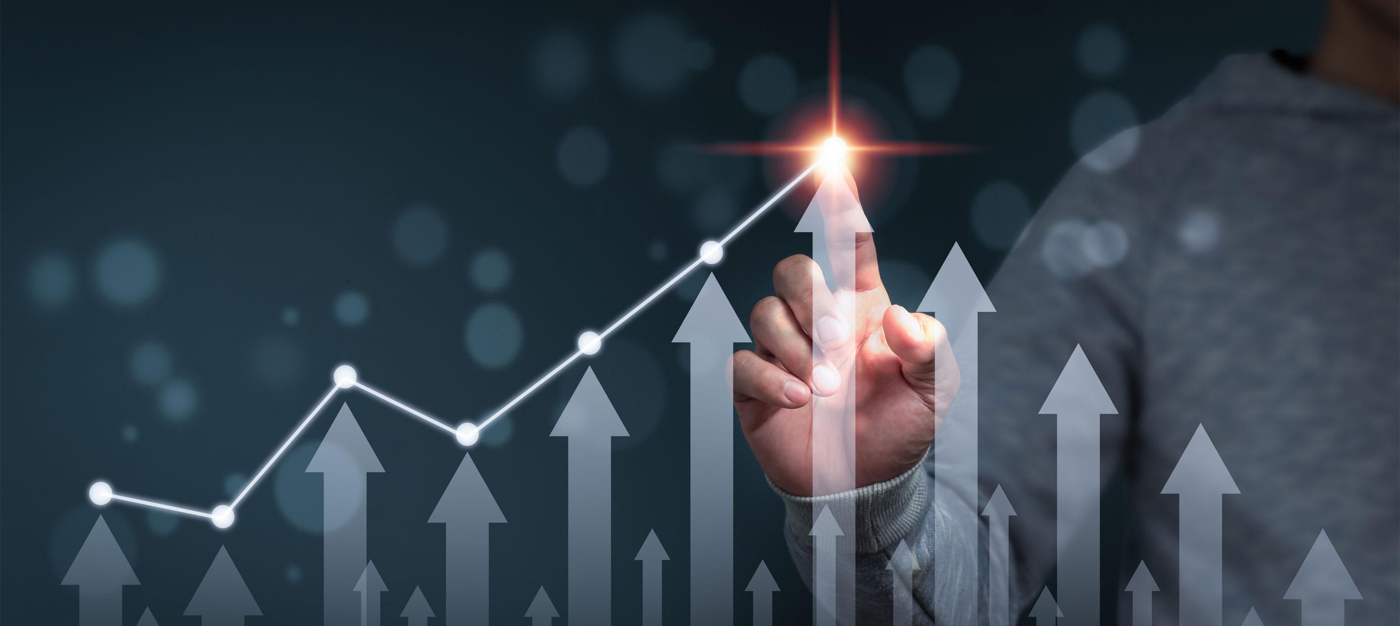 A person pointing to an arrow bar chart