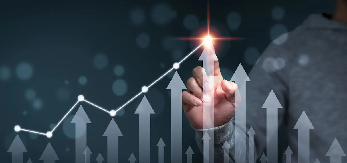 A person pointing to an arrow bar chart