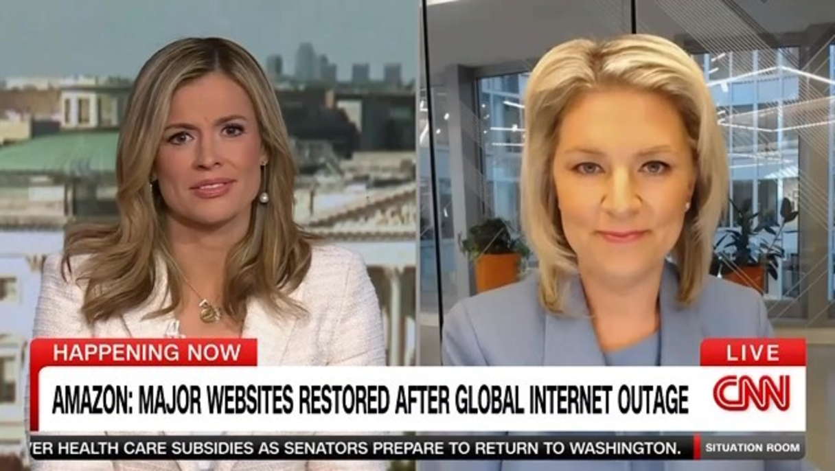Two female news anchors in a split-screen live CNN broadcast discussing restoration of major websites after a global internet outage.