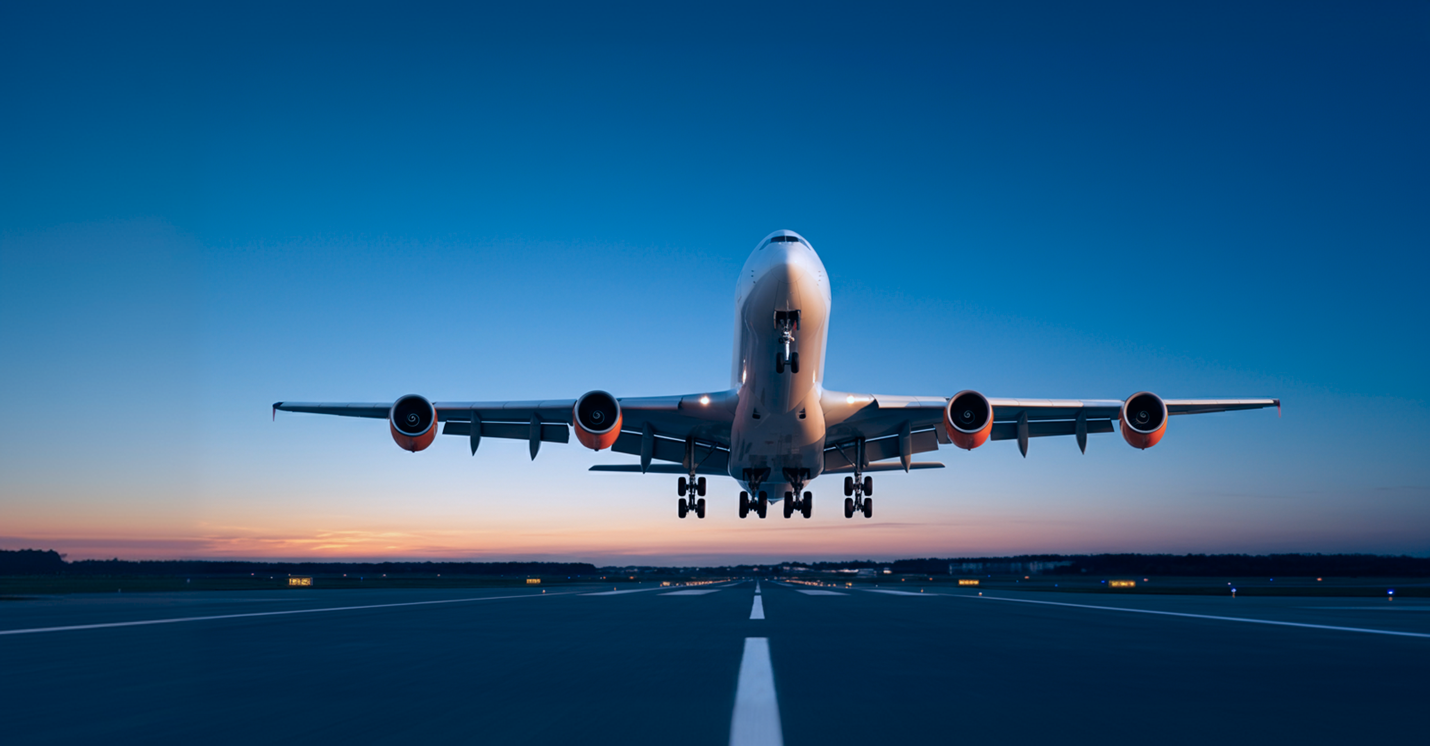 A plane taking off on a runway