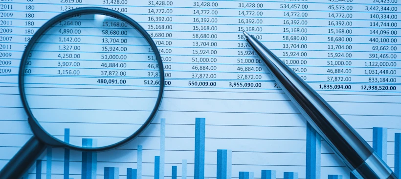 Magnifying glass on financial report